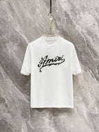 AMIRI Ornate Script Logo Short‑Sleeve Tee