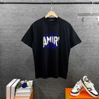 AMIRI Layered Metallic‑Effect Letter Graphic Short‑Sleeve Tee