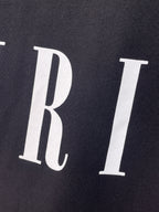 AMIRI Serif Core Logo Graphic Short‑Sleeve Tee