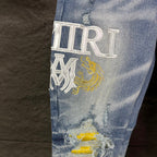 AMIRI Yellow Patch Distressed Printed Slim‑Fit Denim Jeans