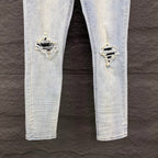 AMIRI Black Ribbed Patch Distressed Slim‑Fit Denim Jeans