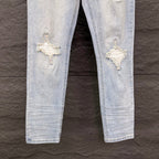 AMIRI White Ribbed Patch Distressed Slim‑Fit Denim Jeans