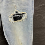 AMIRI Black Ribbed Patch Distressed Slim‑Fit Denim Jeans